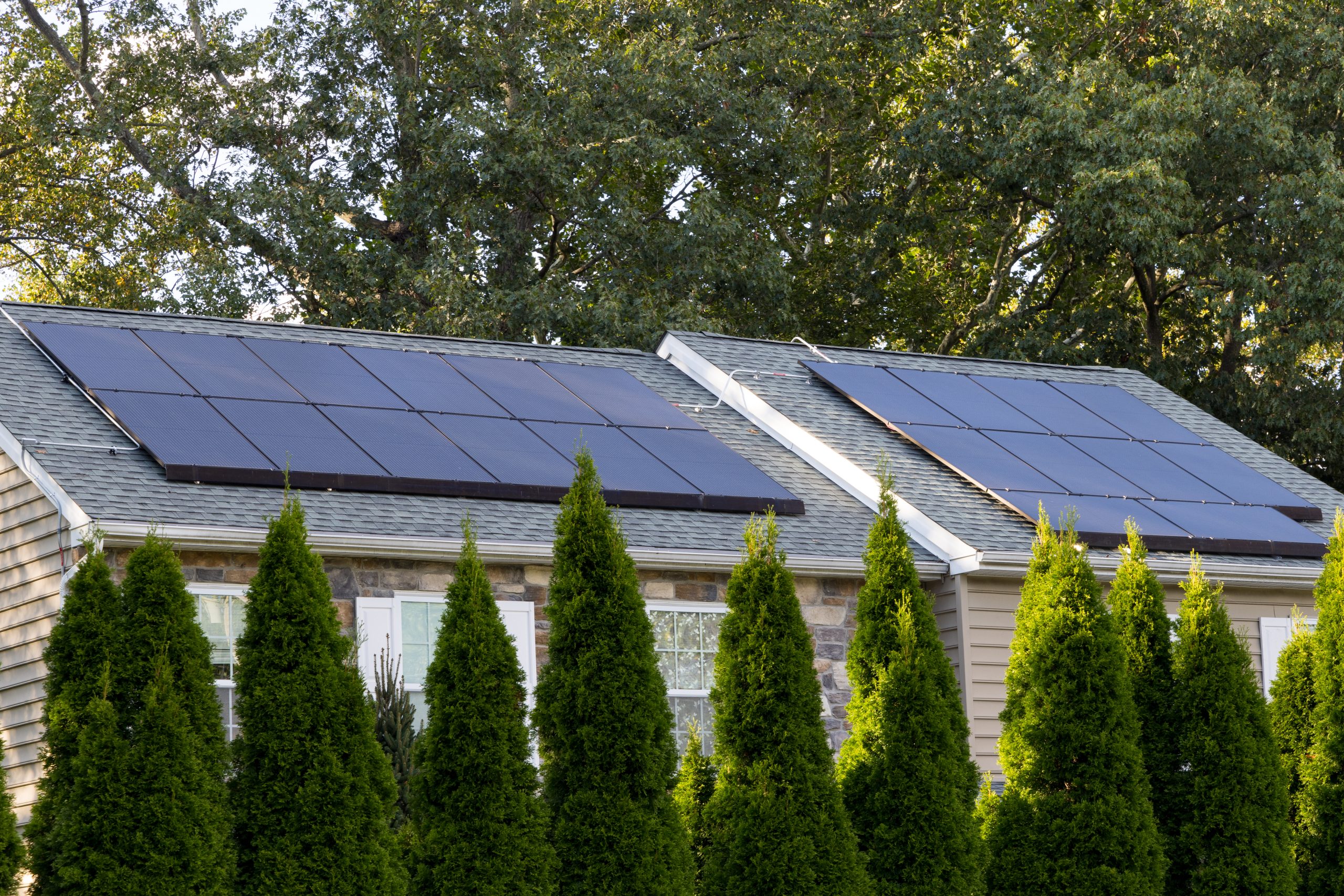 solar panels producing clean energy on a roof of a residential house